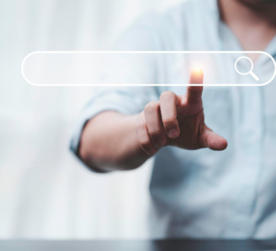 Hand touching with search icon for search engine optimisation or seo concept to find information by internet connection