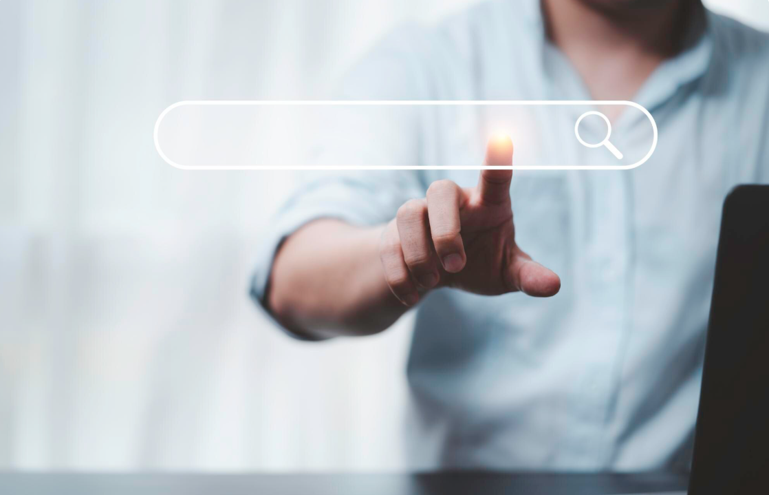 Hand touching with search icon for search engine optimisation or seo concept to find information by internet connection